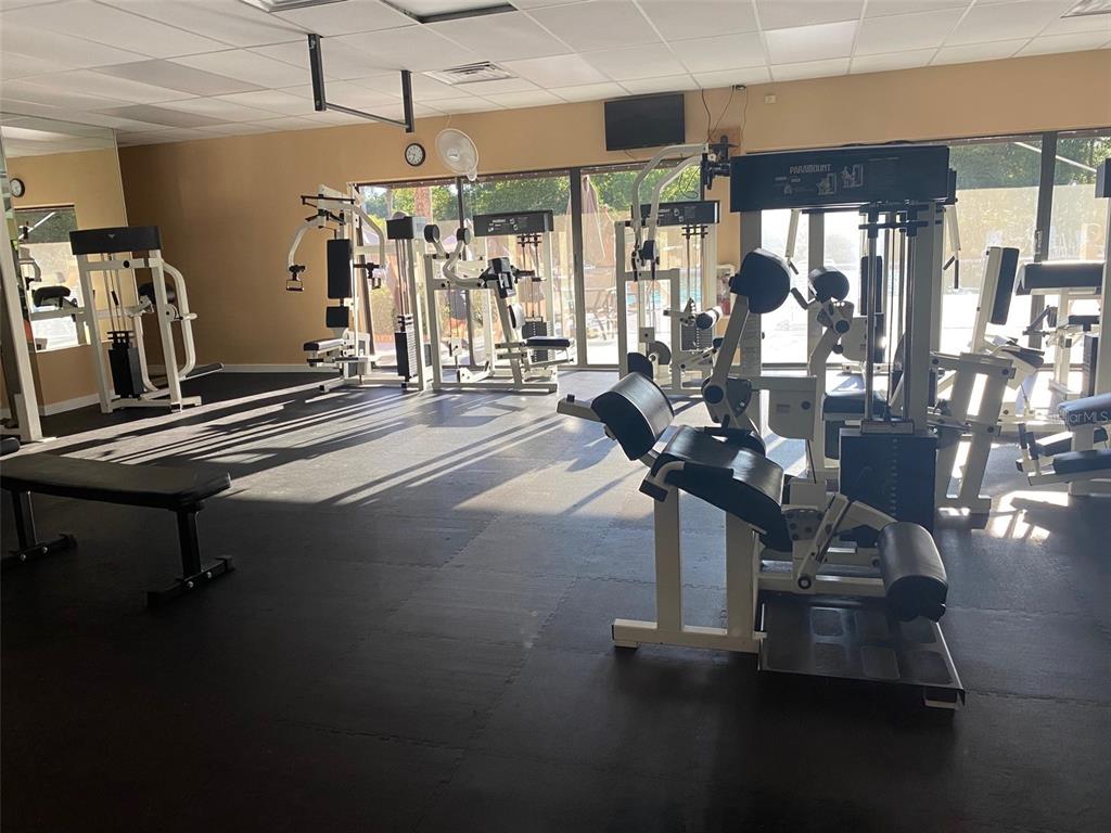 2656 Southwest 20th Circle Ocala, FL 34471 - Photo 3 of 6 a room with gym equipment and large windows