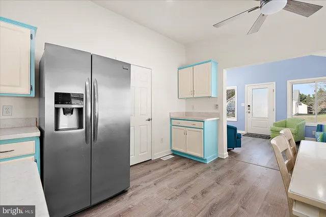 a kitchen with a refrigerator and a sink