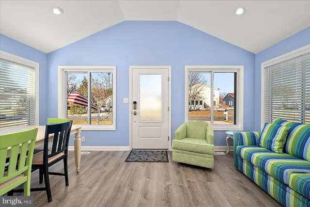 a bedroom with furniture and a window