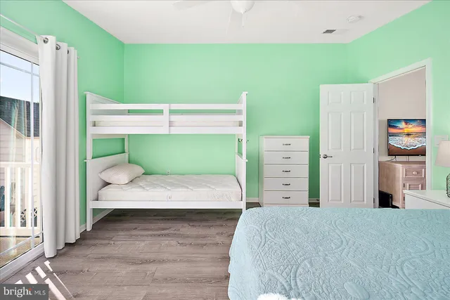 a view of a house with a yard and wooden floor