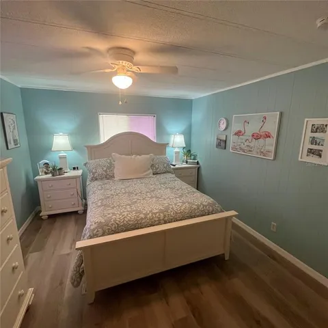 a bedroom with a bed and a lamp
