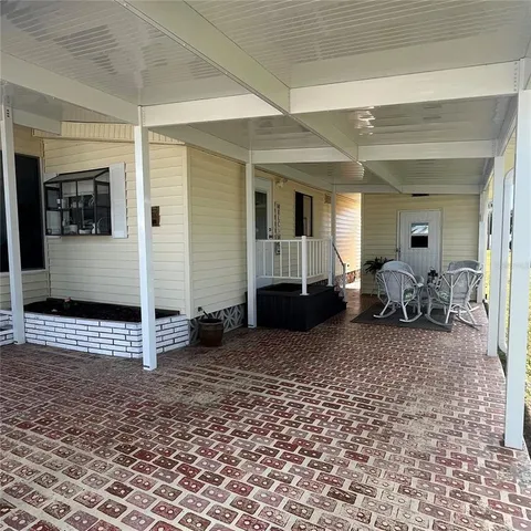 a kitchen with granite countertop cabinets and white appliances