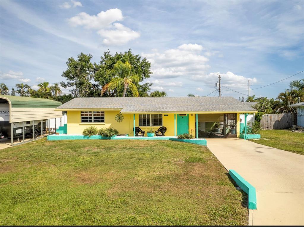 1161 Kimball Road Venice, FL 34293 - Photo 1 of 1 a front view of a house with a big yard