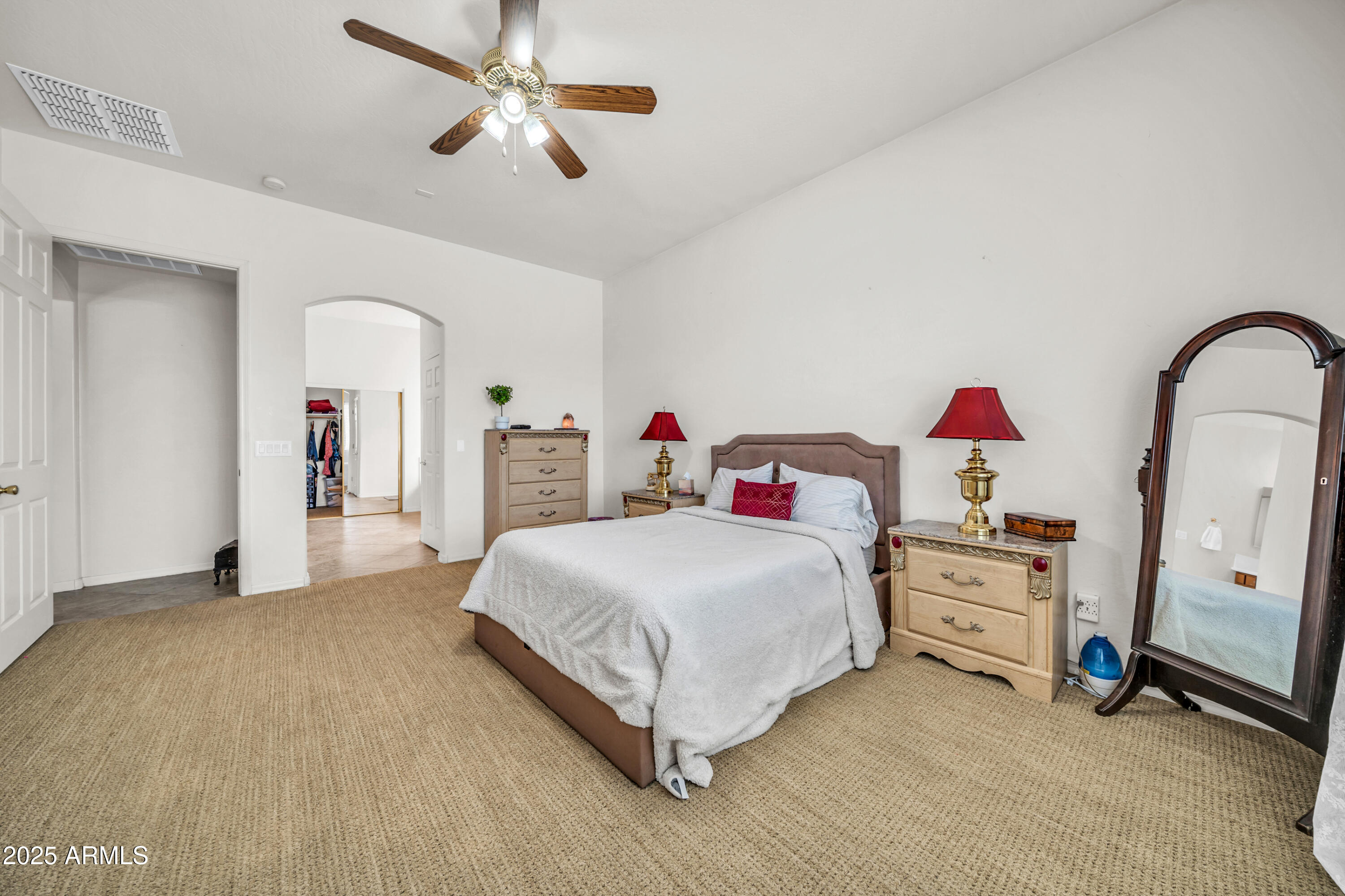 4314 West Summerside Road Laveen, AZ 85339 - Photo 13 of 26 a bedroom with a bed and a chandelier