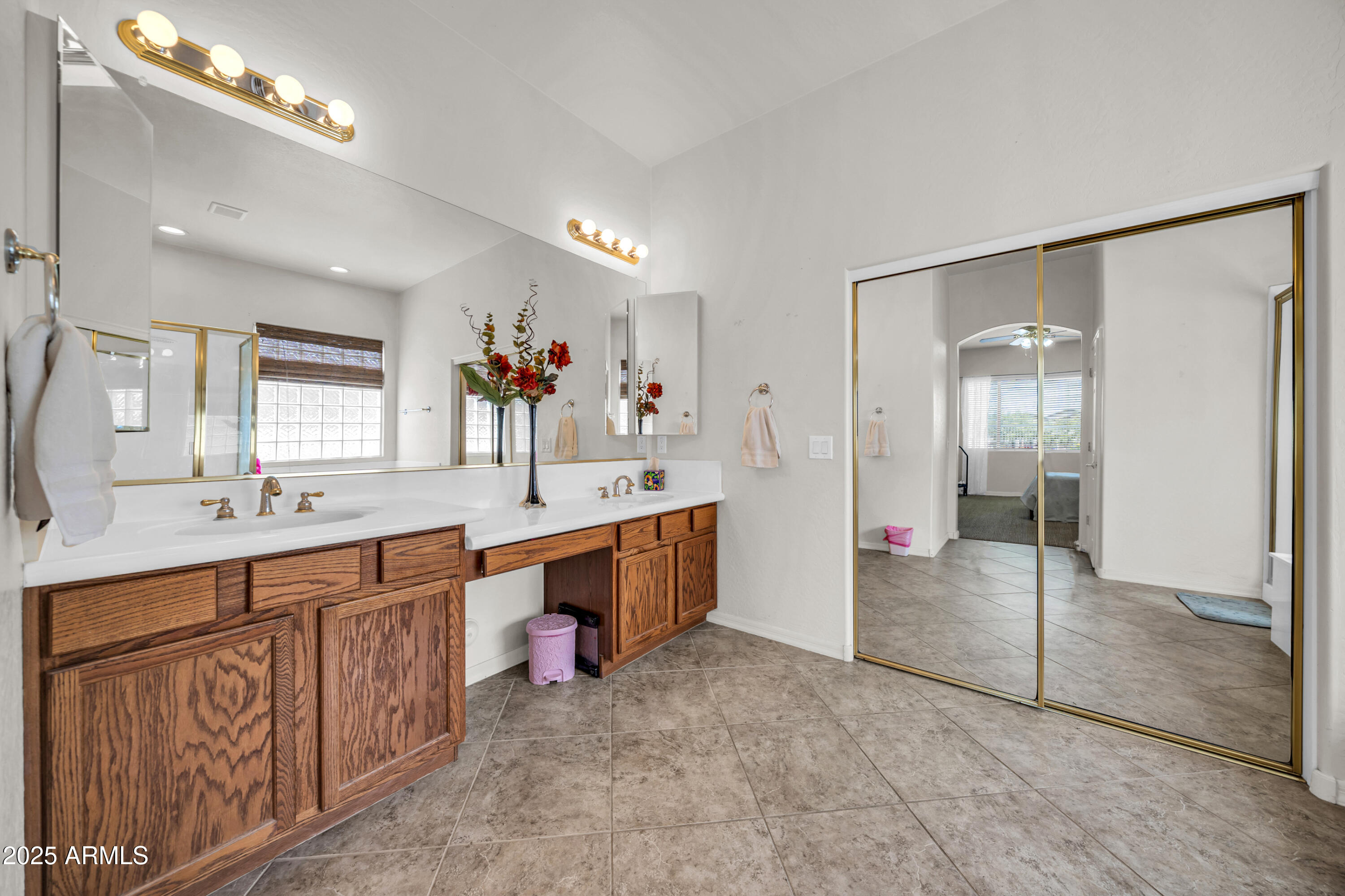 4314 West Summerside Road Laveen, AZ 85339 - Photo 16 of 26 a large bathroom with a large mirror vanity and sink