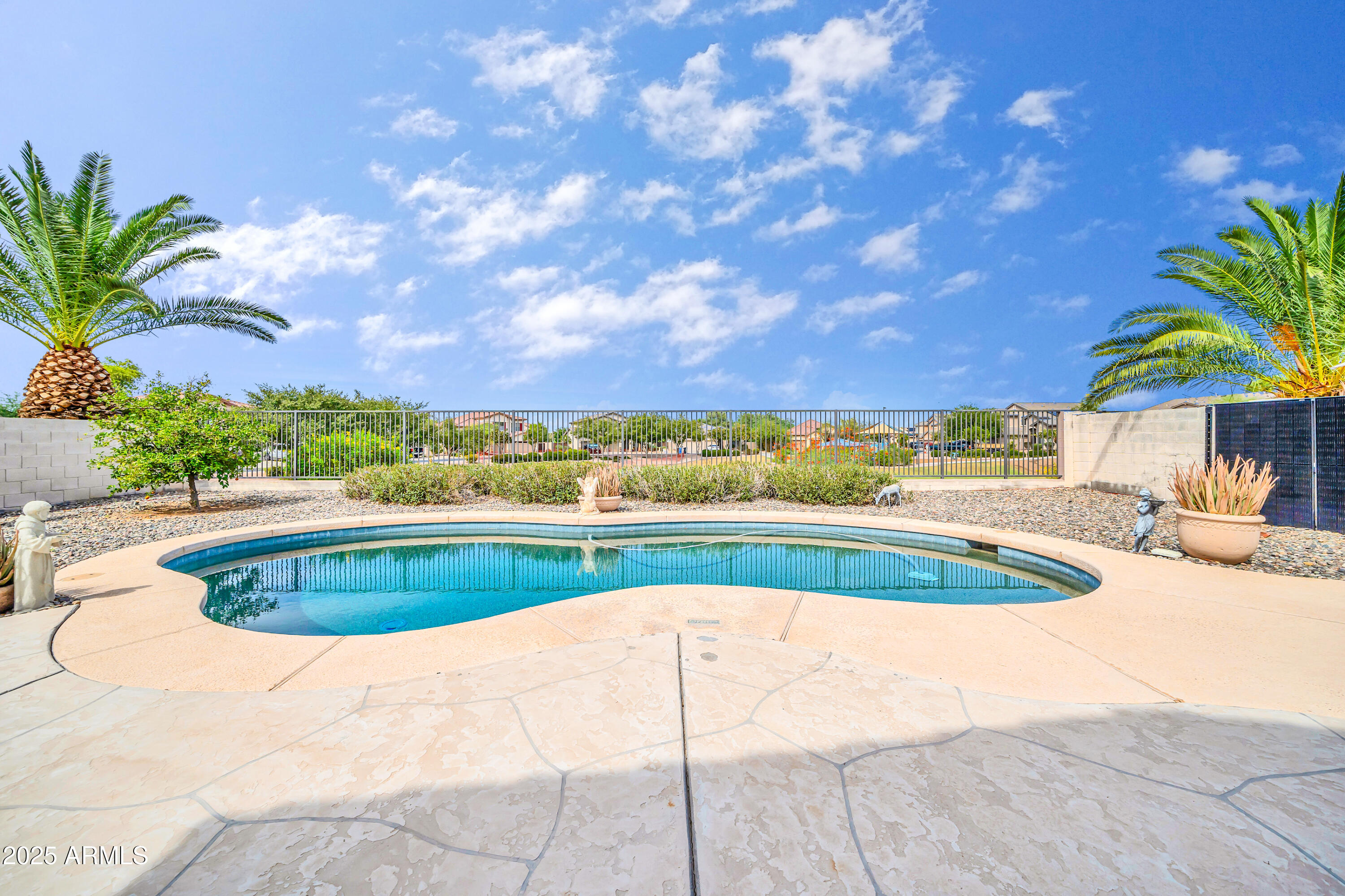 4314 West Summerside Road Laveen, AZ 85339 - Photo 5 of 26 a view of a swimming pool and an outdoor space