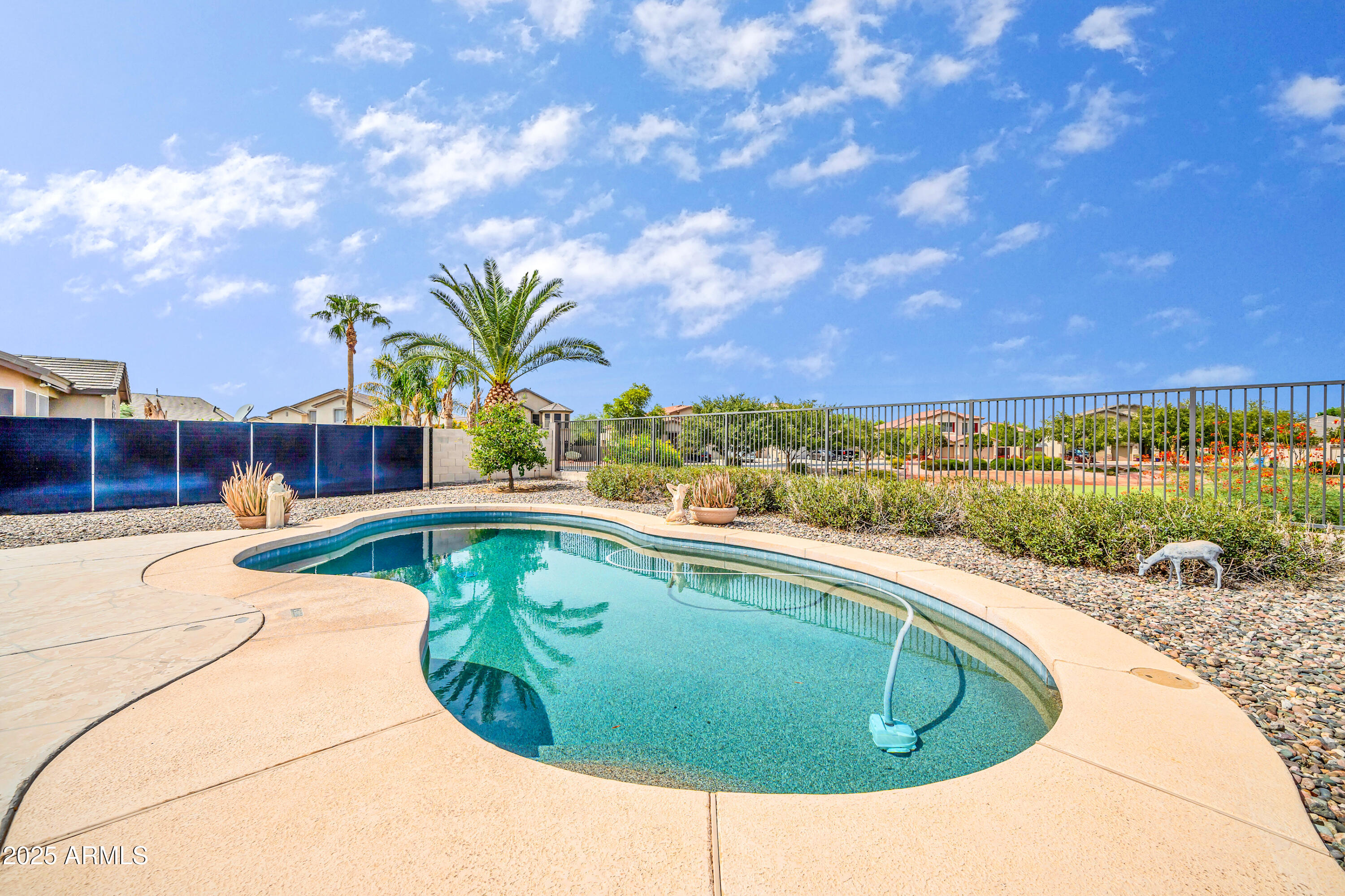 4314 West Summerside Road Laveen, AZ 85339 - Photo 6 of 26 a view of a swimming pool with a yard and a fire pit