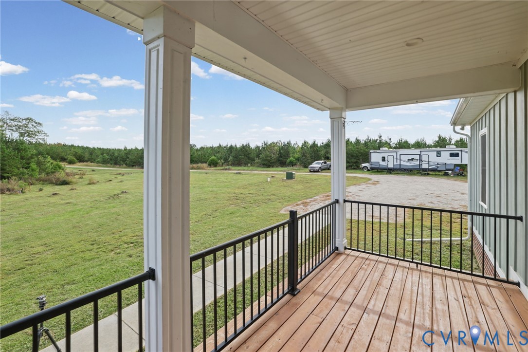 115 Jenkins Church Road Cumberland, VA 23040 - Photo 3 of 28 Covered porch with wood-finish decking, black meta