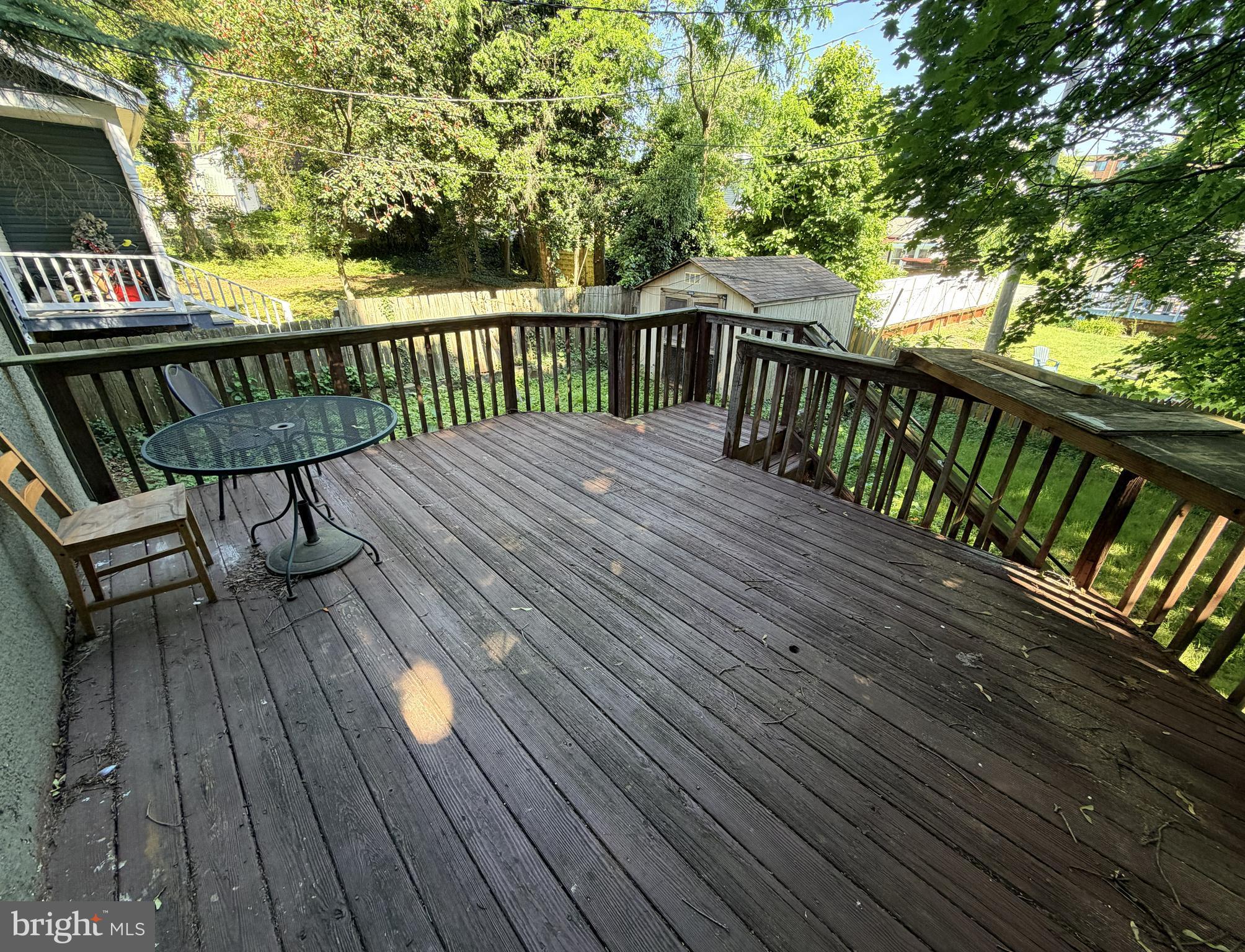 506 Cedarcroft Road Baltimore, MD 21212 - Photo 14 of 16 a view of deck with wooden floor and outdoor seating