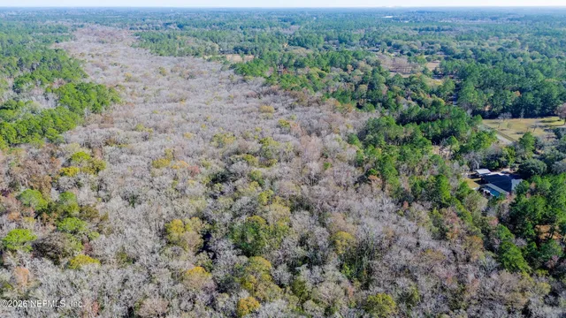 an aerial view of residential house with outdoor space