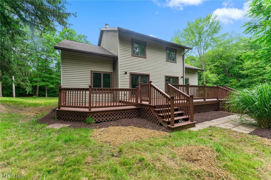 6881 Chestnut-Ridge Road Hubbard, OH 44425 - Photo 38 of 46 Back of house with a yard and a wooden deck