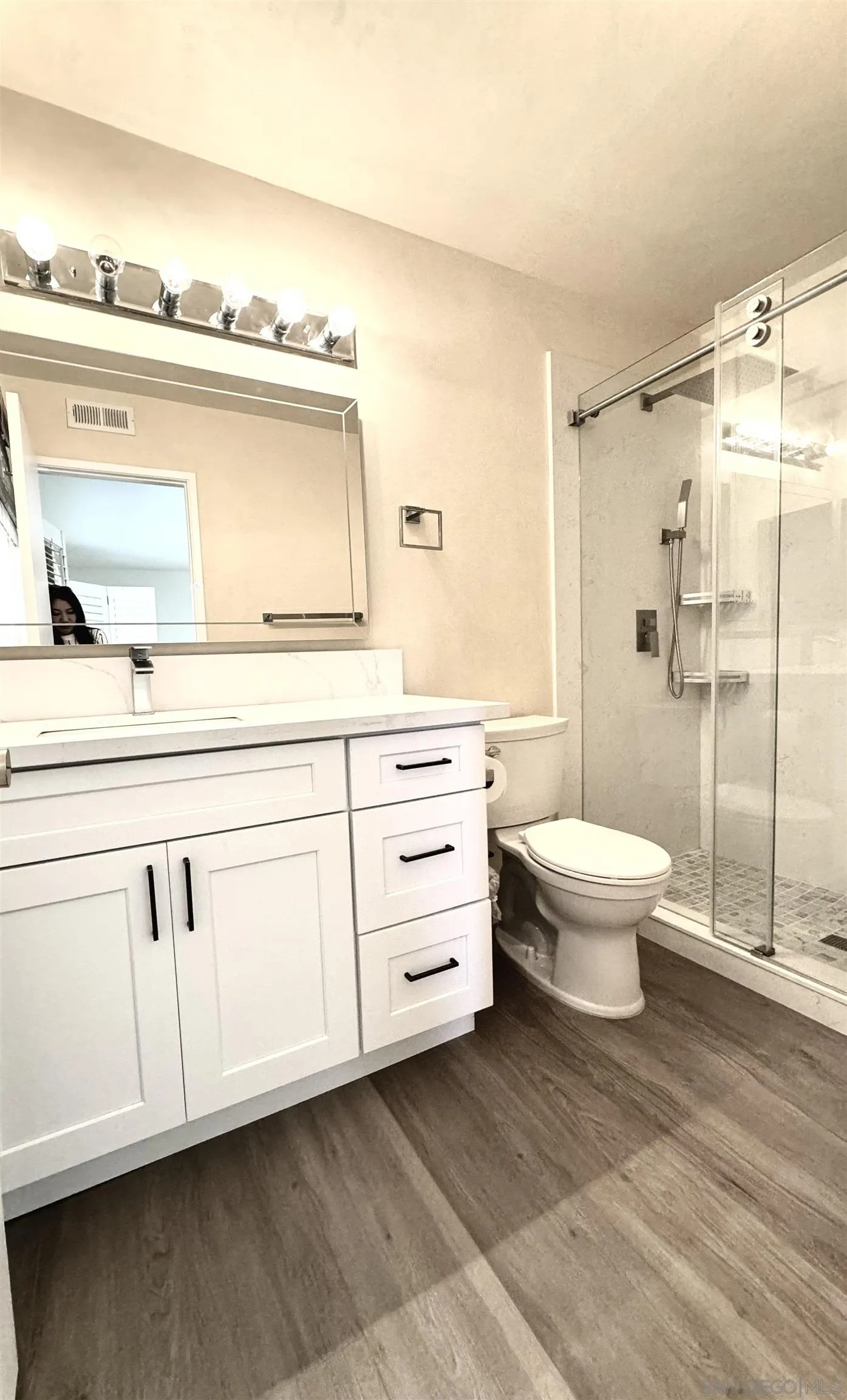 3754 Cameo Drive Oceanside, CA 92056 - Photo 12 of 31 a bathroom with a sink a toilet and shower
