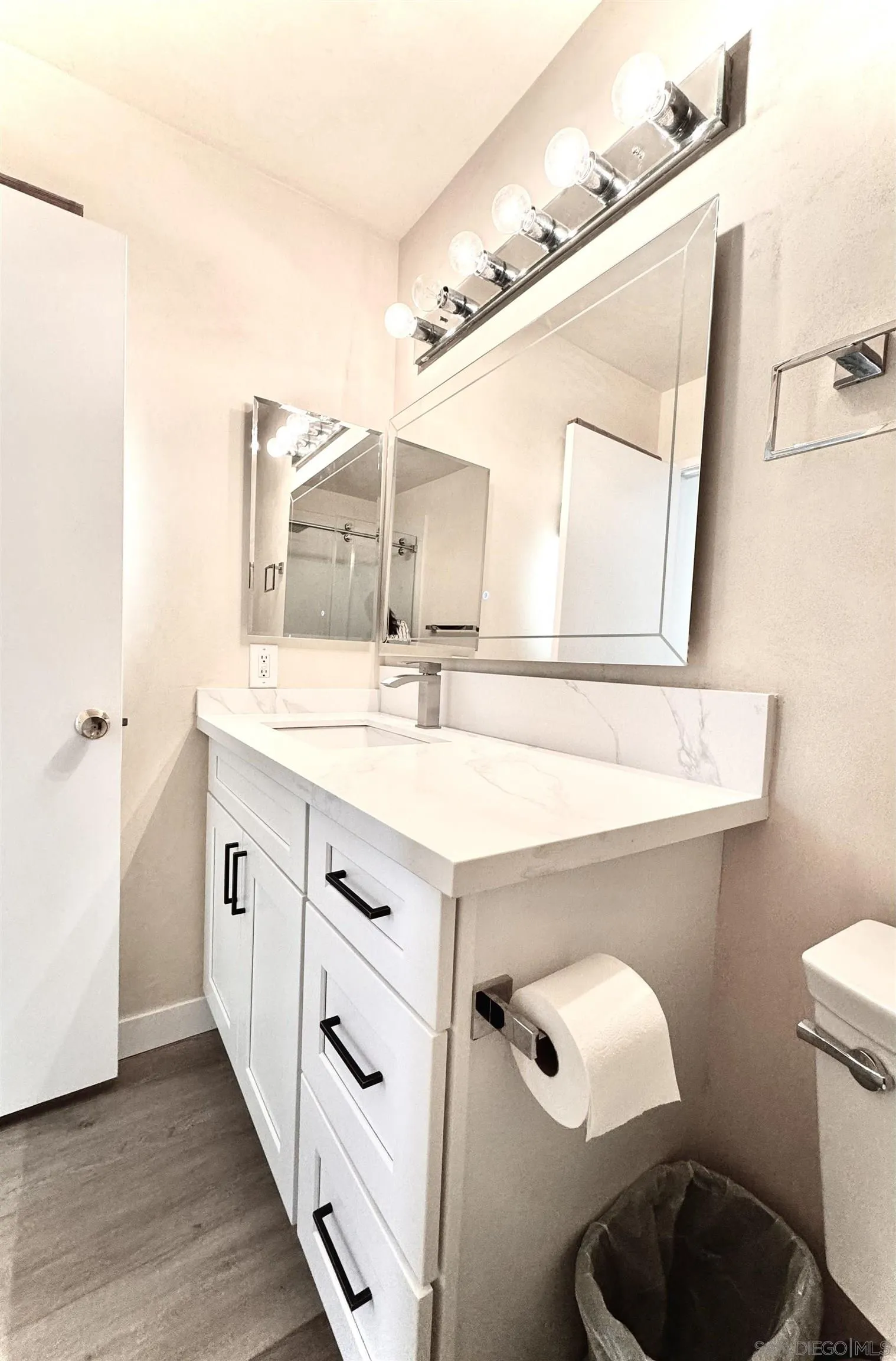 3754 Cameo Drive Oceanside, CA 92056 - Photo 13 of 31 a bathroom with a double vanity sink mirror and toilet