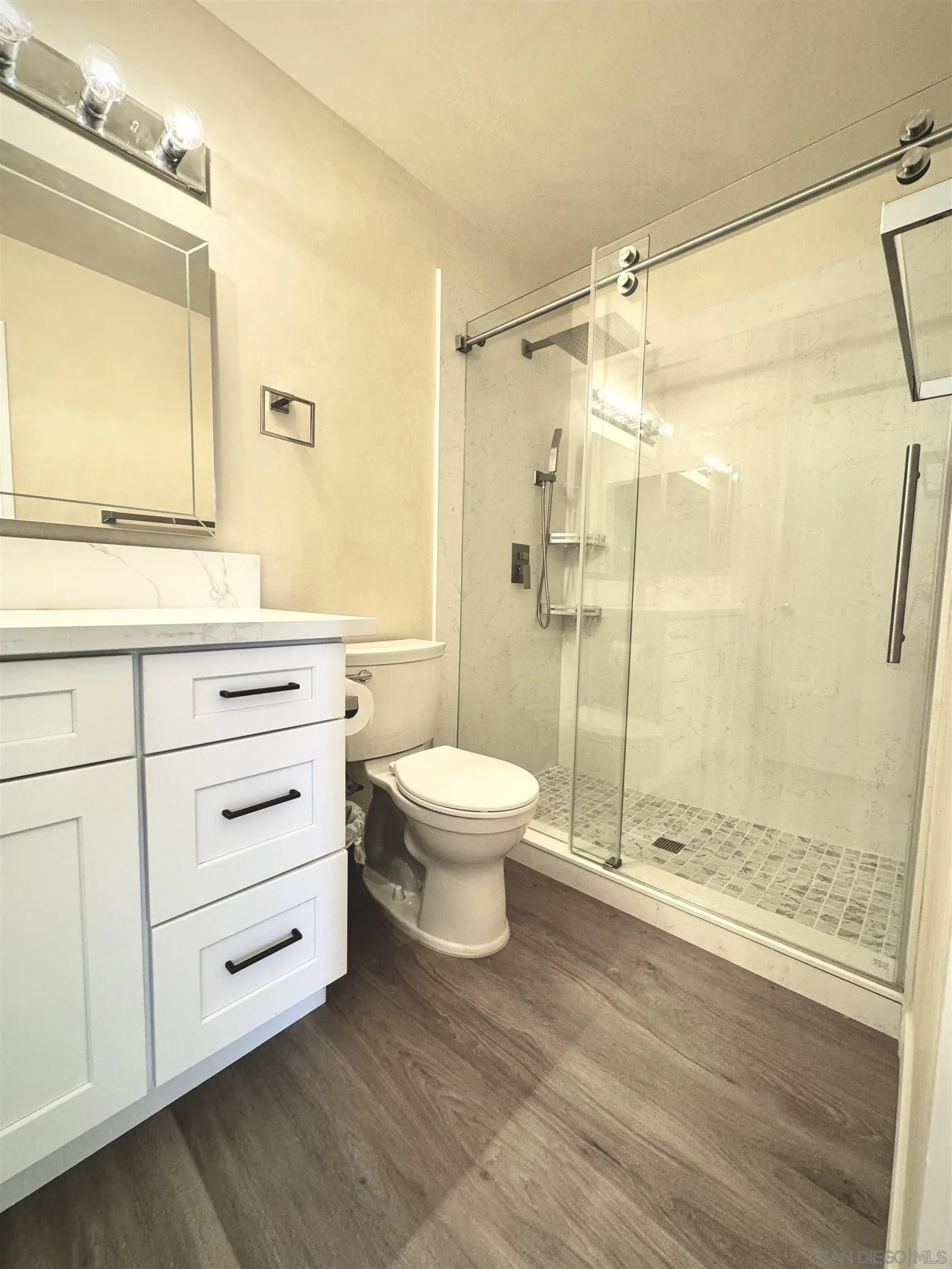 3754 Cameo Drive Oceanside, CA 92056 - Photo 14 of 31 a bathroom with a granite countertop sink toilet and shower