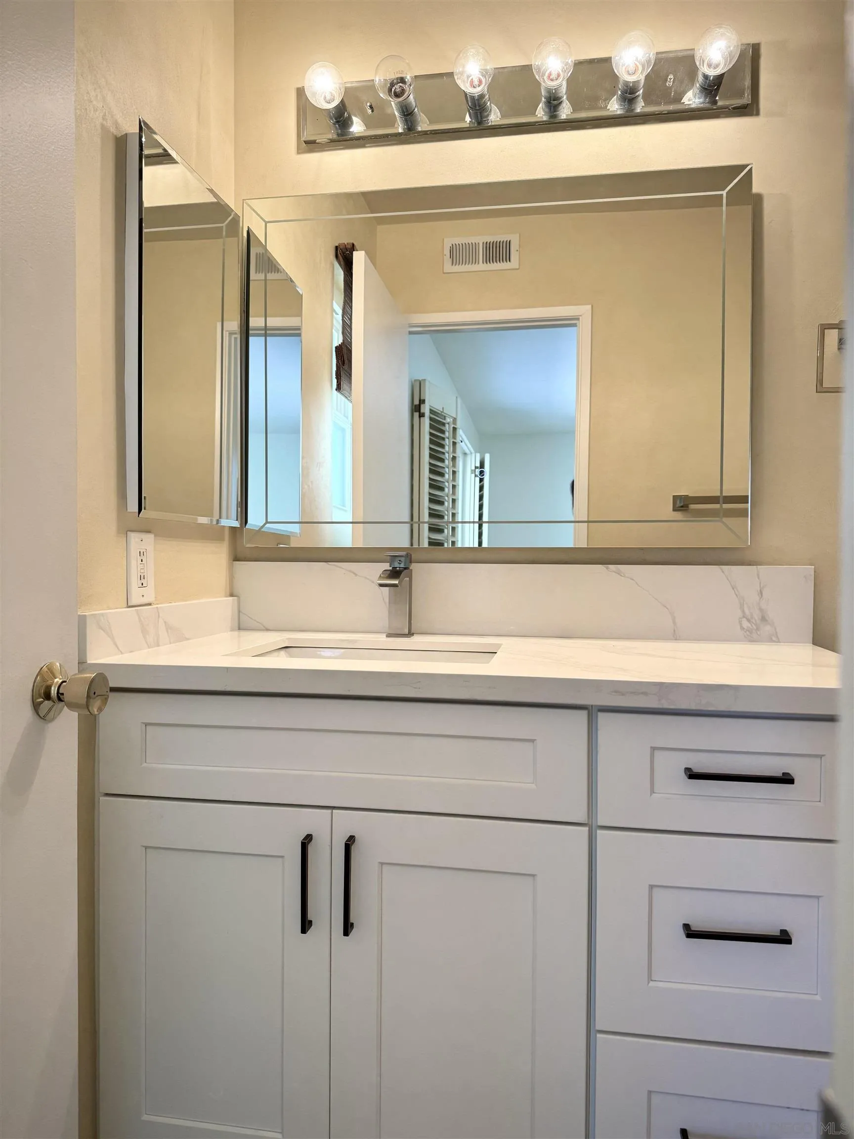 3754 Cameo Drive Oceanside, CA 92056 - Photo 15 of 31 a bathroom with a sink and a mirror