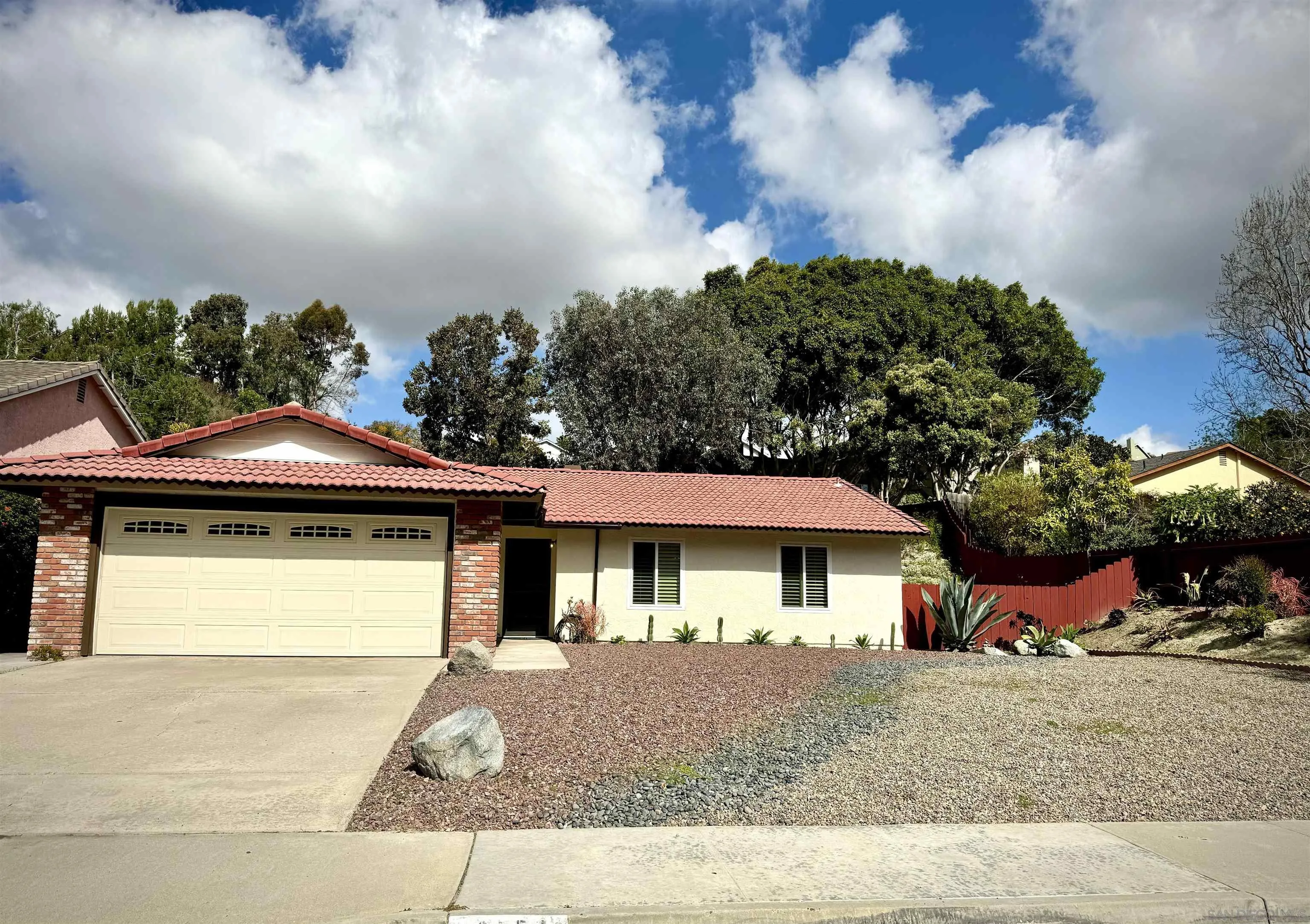 3754 Cameo Drive Oceanside, CA 92056 - Photo 2 of 31 a front view of a house with a yard