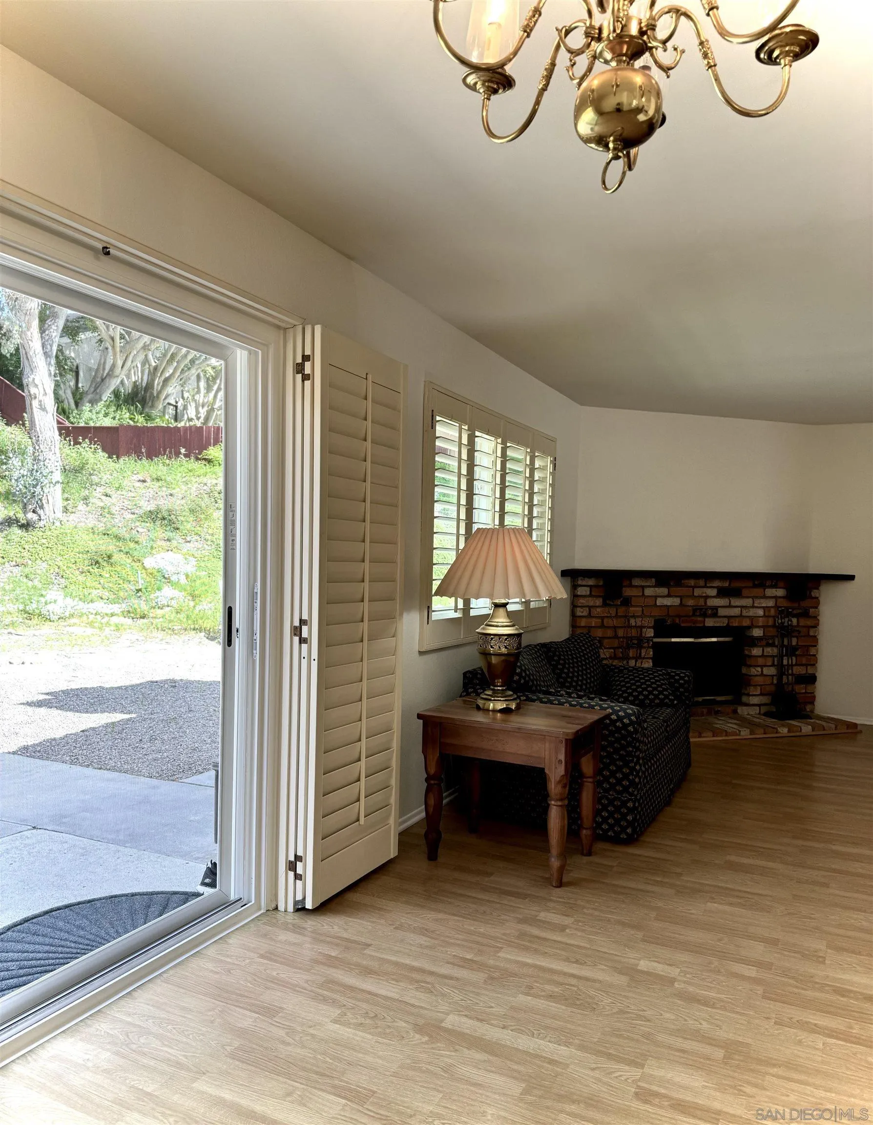 3754 Cameo Drive Oceanside, CA 92056 - Photo 5 of 31 a living room with furniture a chandelier and a window