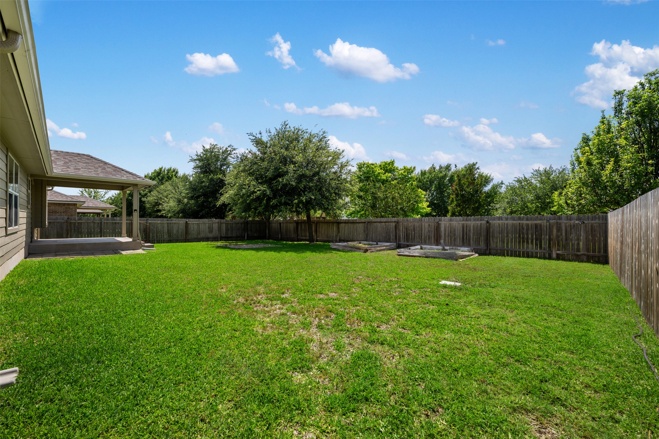 18820 Edinburgh Castle Road Pflugerville, TX 78660 - Photo 33 of 37 a view of yard with swimming pool and green space