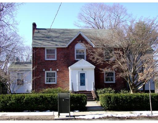 299 Beverly Road Brookline, MA 02467 - Photo 1 of 22 a front view of a house with a yard