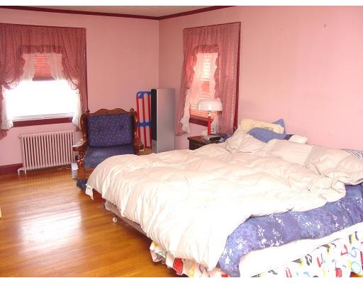 299 Beverly Road Brookline, MA 02467 - Photo 13 of 22 a spacious bedroom with a bed and wooden floor