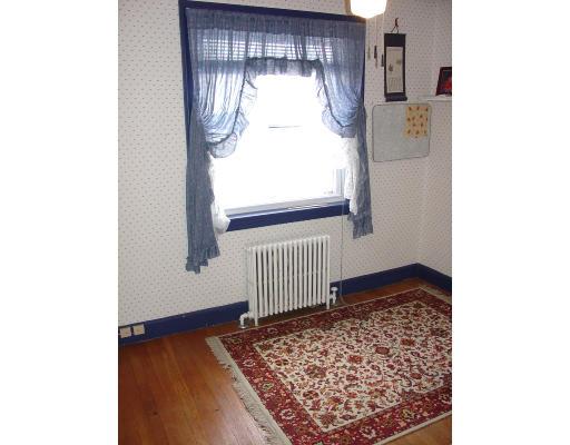 299 Beverly Road Brookline, MA 02467 - Photo 17 of 22 a front view of a house with a rug
