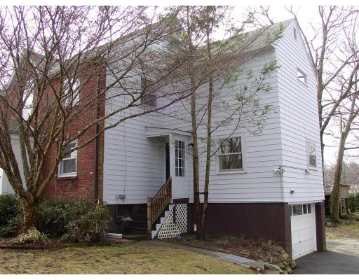 299 Beverly Road Brookline, MA 02467 - Photo 19 of 22 a front view of a house with trees