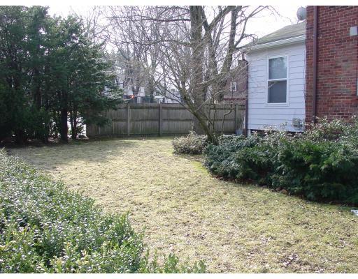 299 Beverly Road Brookline, MA 02467 - Photo 20 of 22 a backyard of a house with lots of green space