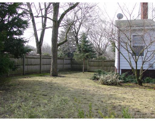 299 Beverly Road Brookline, MA 02467 - Photo 21 of 22 a backyard of a house with lots of green space