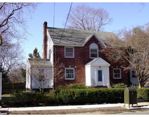 299 Beverly Road Brookline, MA 02467 - Photo 22 of 22 a front view of a house with a yard