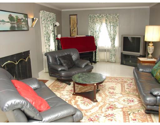 299 Beverly Road Brookline, MA 02467 - Photo 3 of 22 a living room with furniture and a flat screen tv