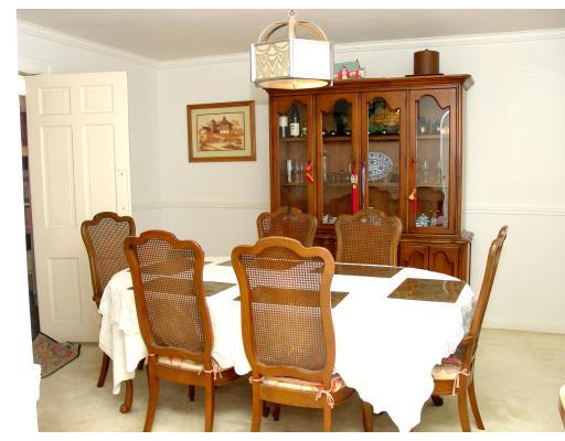 299 Beverly Road Brookline, MA 02467 - Photo 4 of 22 a view of a dining room with furniture and chandelier