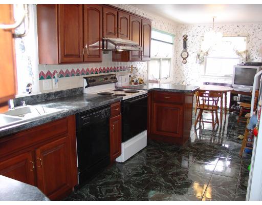 299 Beverly Road Brookline, MA 02467 - Photo 7 of 22 a kitchen with stainless steel appliances granite countertop a sink stove and cabinets