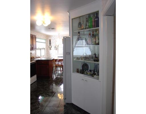 299 Beverly Road Brookline, MA 02467 - Photo 9 of 22 a kitchen with a sink and a refrigerator