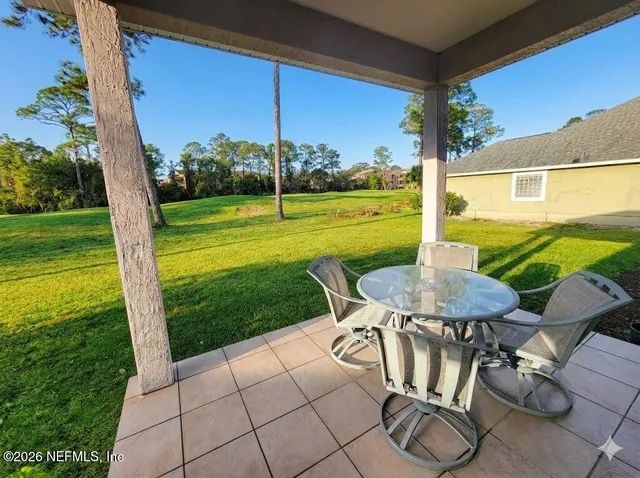 a view of an outdoor sitting area with furniture