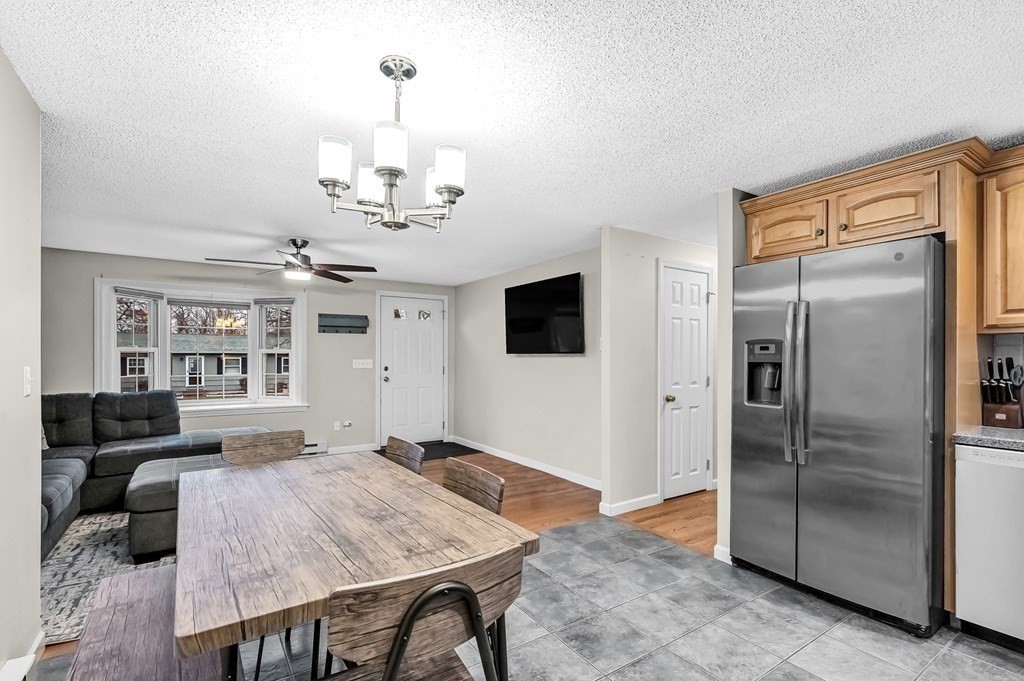 47 Sierra Vista Road Springfield, MA 01128 - Photo 8 of 42 a view of a kitchen with stainless steel appliances granite countertop a refrigerator and a stove top oven