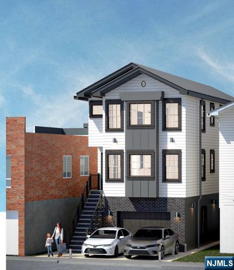 6211 Adams Street West New York, NJ 07093 - Photo 4 of 6 a front view of a house with many windows