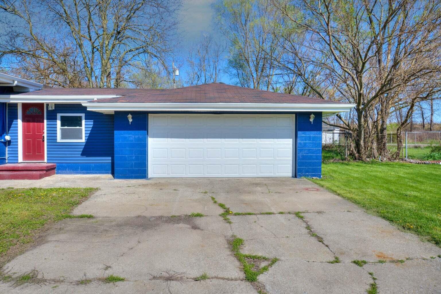 2713 Jefferson Street Gary, IN 46407 - Photo 2 of 19 a house that has a tree in front of the house