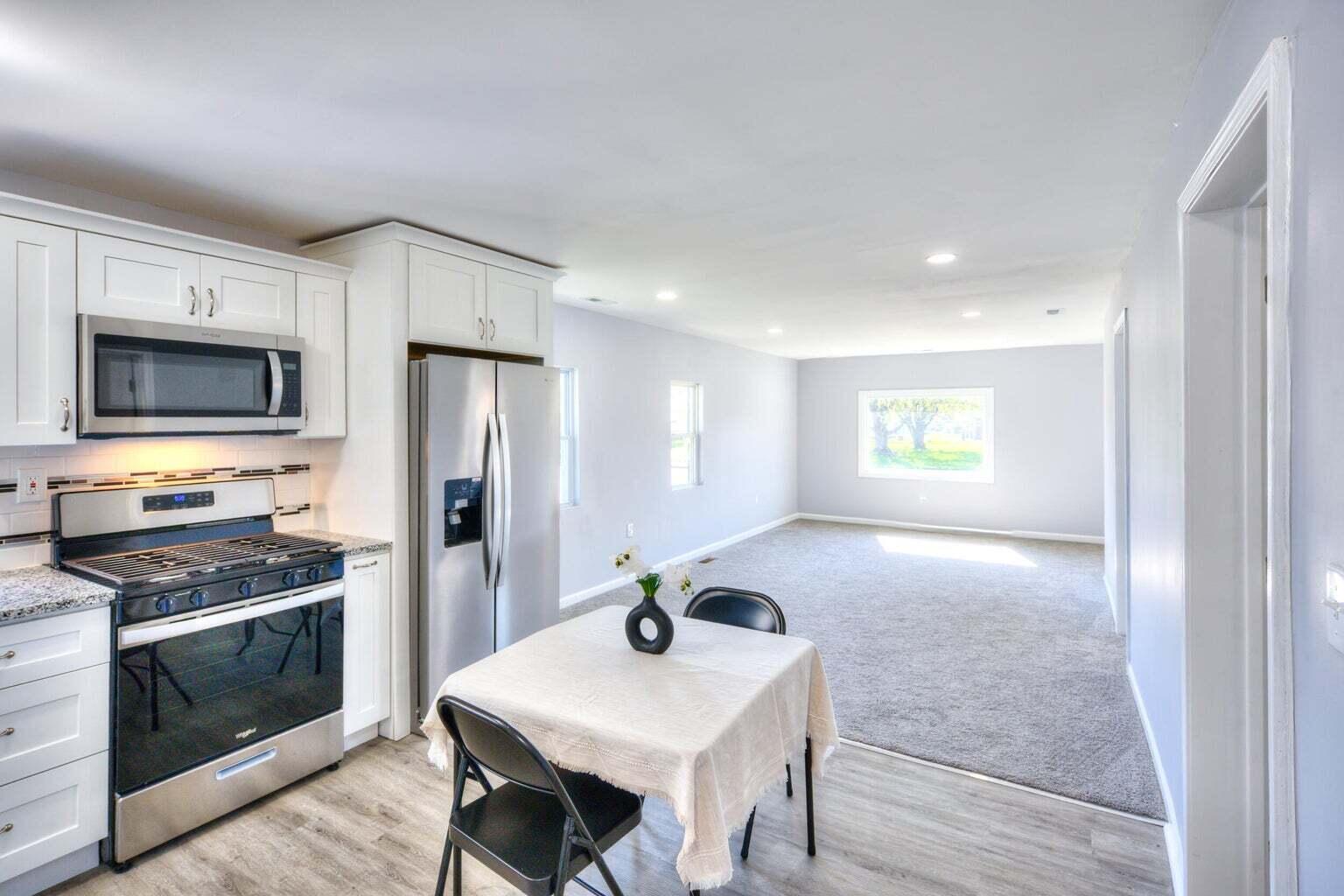2713 Jefferson Street Gary, IN 46407 - Photo 4 of 19 a kitchen with a stove a sink and a refrigerator