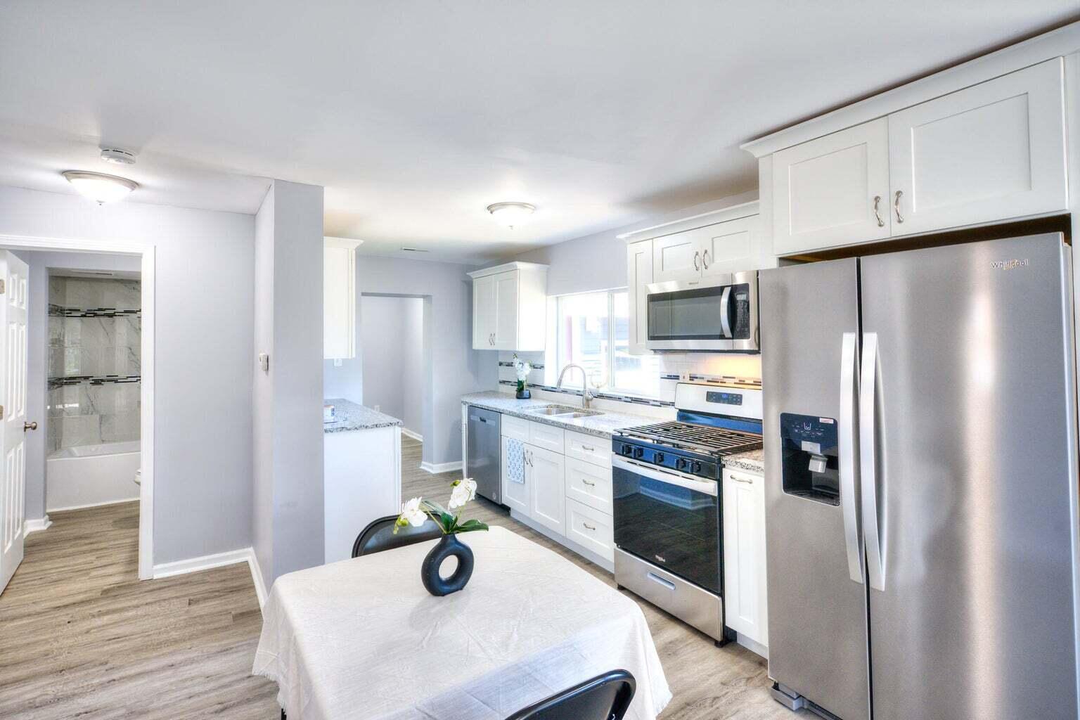 2713 Jefferson Street Gary, IN 46407 - Photo 5 of 19 a kitchen with stainless steel appliances a refrigerator sink and stove