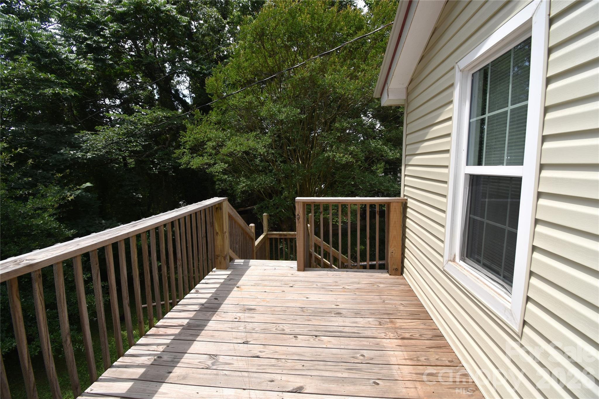 622 Green St Loop Marion, NC 28752 - Photo 14 of 16 a balcony with wooden floor and fence