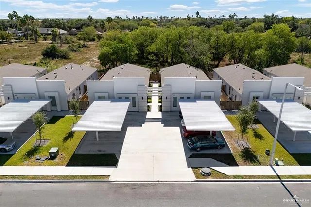 an aerial view of a house with swimming pool