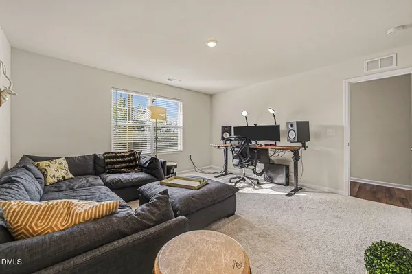 a bedroom with a bed and a desk