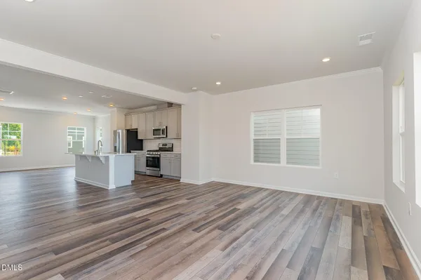 a view of balcony with wooden floor and fence