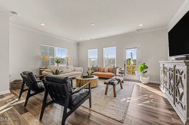 a bathroom with a sink mirror toilet and next to a window
