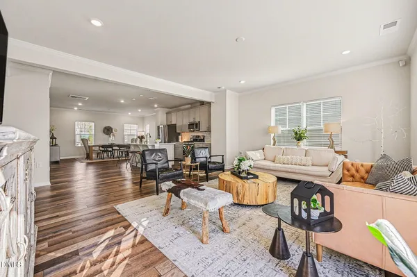a bathroom with a sink mirror toilet and next to a window