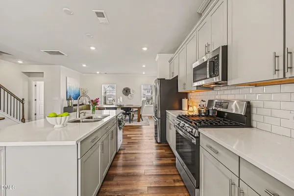 a bathroom with a double vanity sink mirror and double