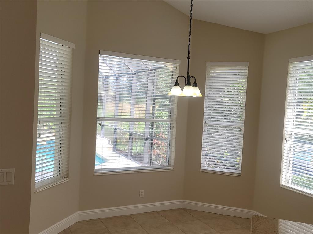 7486 Edenmore Street Lakewood Ranch, FL 34202 - Photo 17 of 28 a view of an empty room with a window