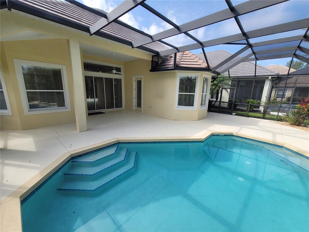 7486 Edenmore Street Lakewood Ranch, FL 34202 - Photo 28 of 28 a view of swimming pool with seating space