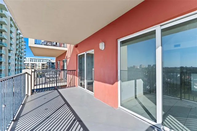 a balcony with an outdoor seating