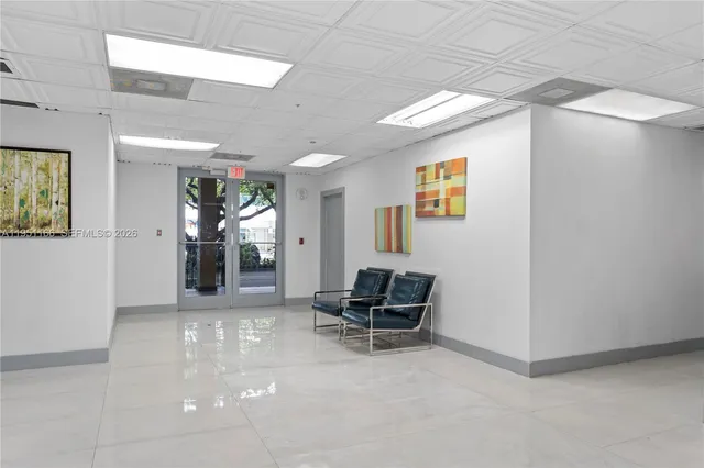 workspace with furniture and paintings on the wall